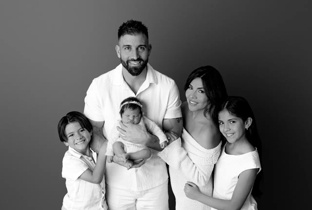 A young Australian family standing together